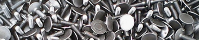 Bulones de fijación para cangilones